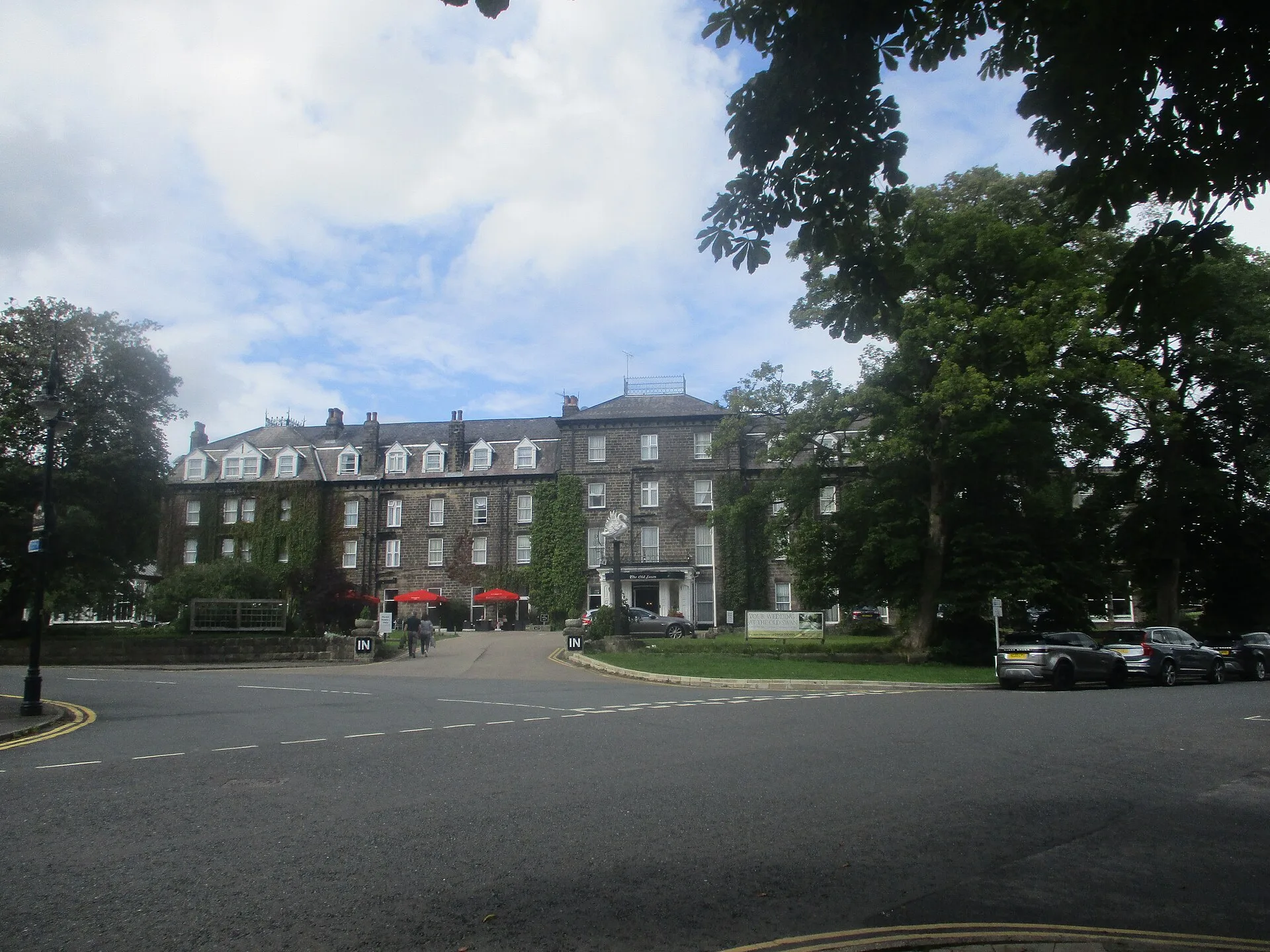 The Old Swan hotel on York Road in Harrogate, seen across the road through trees