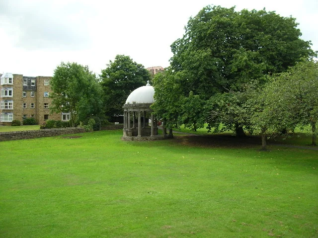 Tewit Well and its domed well cover beside The Stray